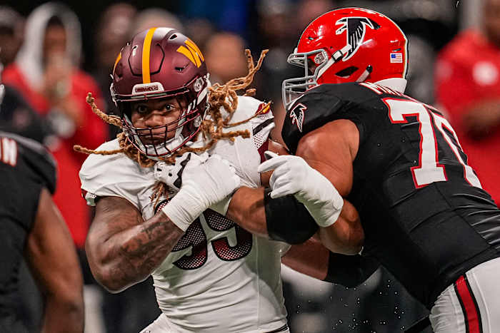 Washington Commanders defensive end Chase Young (99) battles with Atlanta Falcons offensive tackle Jake Matthews.